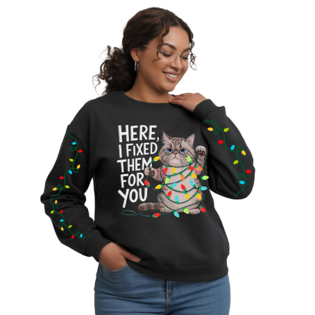 Woman wearing a black sweatshirt with a cat graphic and text on a white background