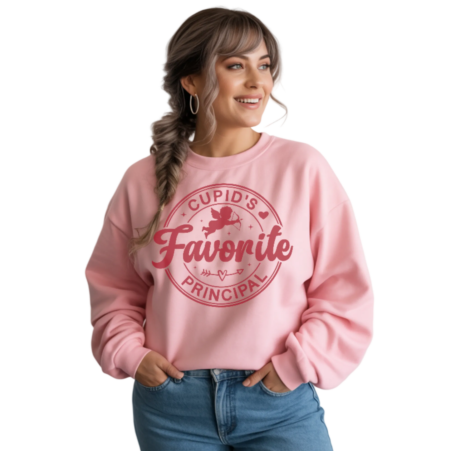 Woman wearing a pink sweatshirt with a round design with the text: cupids favorite principal.