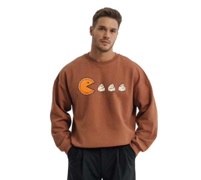 Man wearing a brown sweatshirt with a cartoon design on a white background