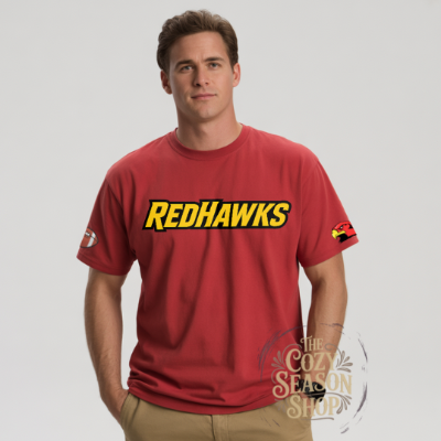 Man wearing a red 'REDHAWKS' t-shirt with a THE COZY SEASON SHOP LOGO on a gray background