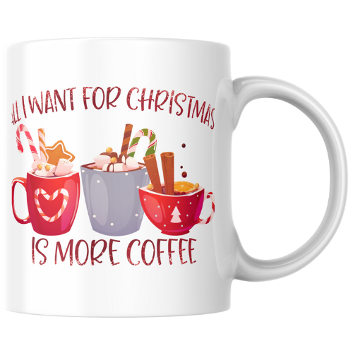 White mug with Christmas-themed design and text 'All I want for Christmas is more coffee' on a white background.