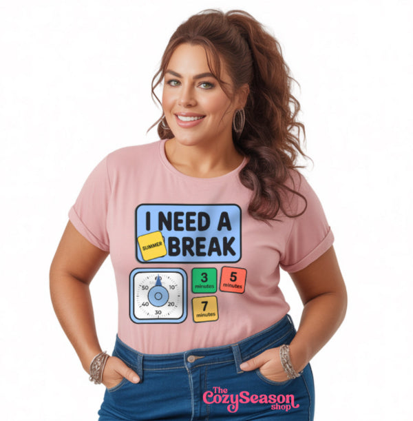 Woman wearing a pink t-shirt with 'I Need a Break' graphic design on a white background