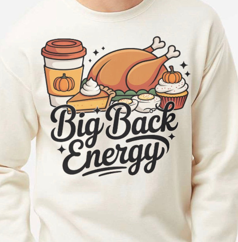 Person wearing a white sweatshirt with Thanksgiving-themed graphics and 'Big Back Energy' text.