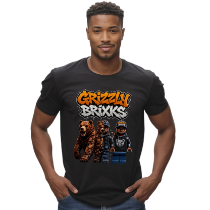 A man wearing a black t-shirt with a colorful graphic that reads 'Grizzly Brixxs' above three cartoon grizzly bear characters, set against a plain white background.