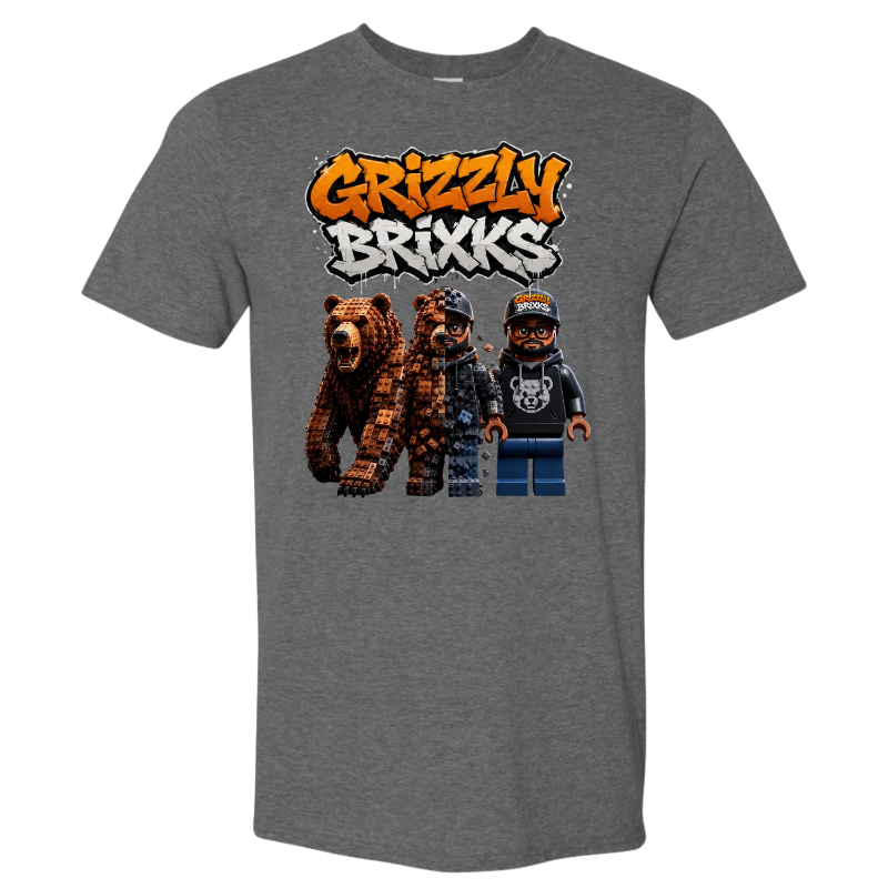 A heather gray short-sleeve t-shirt featuring a graphic print of the 'Grizzly Brixks' logo in orange and white graffiti-style lettering above three pixel-art characters resembling LEGO minifigures, one brown bear and two humans.