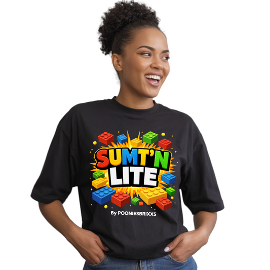 Person wearing a black t-shirt with colorful text and graphics on a white background