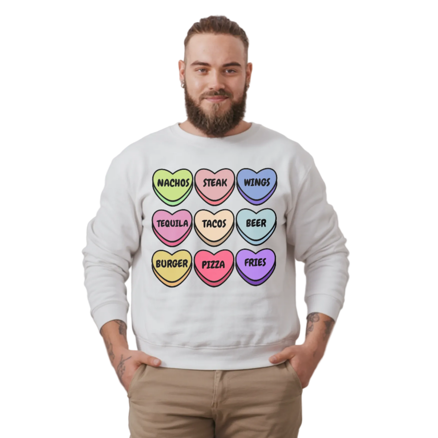 Person wearing a white sweatshirt with colorful heart-shaped text design on a plain background