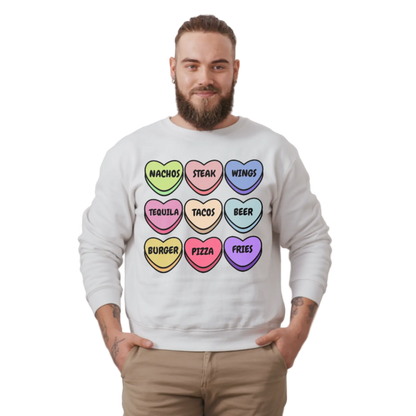 Person wearing a white sweatshirt with colorful heart-shaped text design on a plain background