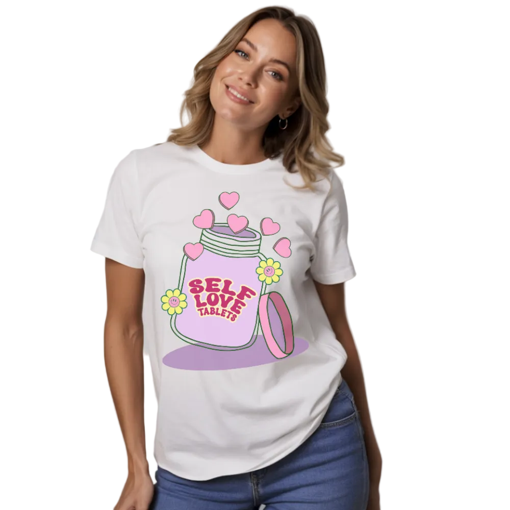 Woman wearing a white t-shirt with a 'Self Love Tablets' design on a white background