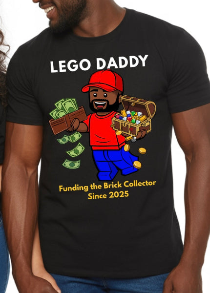 a mock up photo of a man wearing a Black t-shirt with the white text on top reading: 'LEGO DADDY' with a Lego mini figure wearing a red t-shirt and blue jeans. the mini figure is holding a wallet that is stuffed with cash, some dollars falling out in one hand. on the other hand he is holding a lego treasure chest with gems, gold bars and gold coins iwth some spilling out. at the very bottom, the text reads "Funding the brick collector since 2025." the year can be personalized. 