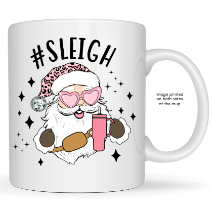 White mug with a graphic of a Santa-like character holding a pink drink, wearing sunglasses and a leopard print hat, with '#Sleigh' text above.