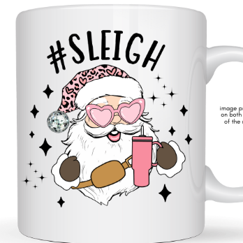 White mug with a graphic of a Santa-like character holding a pink drink, wearing sunglasses and a leopard print hat, with '#Sleigh' text above.