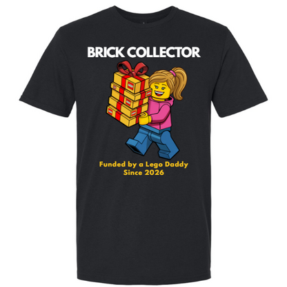 Black t-shirt with a graphic of a LEGO character holding gifts and text 'BRICK COLLECTOR' and 'Funded by a Lego Daddy Since 2026'.