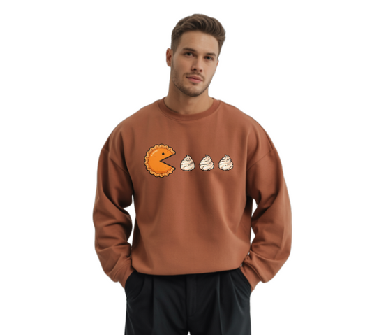 Man wearing a brown sweatshirt with a cartoon design on a white background