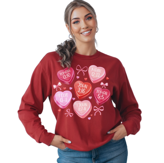 Woman wearing a red sweatshirt with heart designs and text on a white background