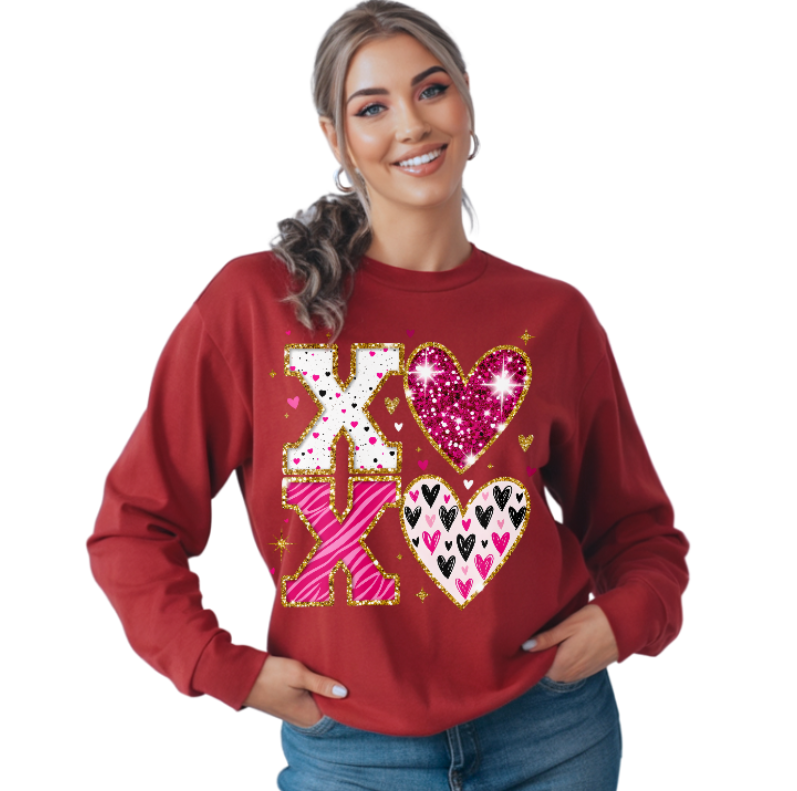 Woman wearing a red sweatshirt with decorative text and hearts on a white background