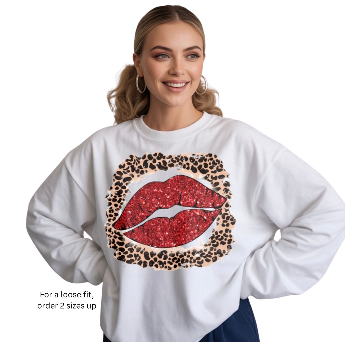 Woman wearing a white sweatshirt with a red lip and leopard print design on a white background