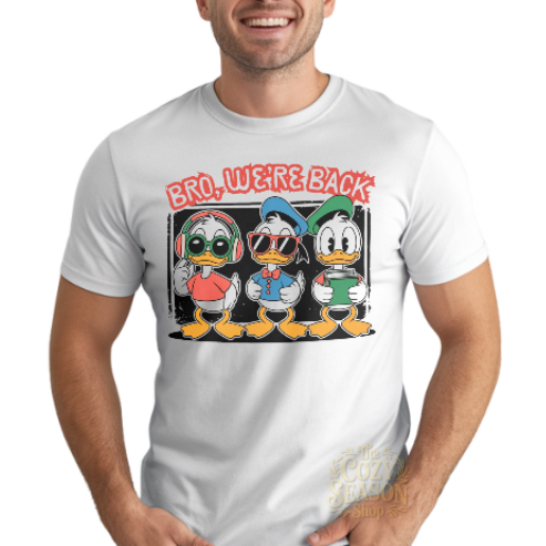 WHITE TEE WITH 3 cartoon ducks holding school supplies and wearing sunglasses. the text on top is in red and it says "bro, we're back" 