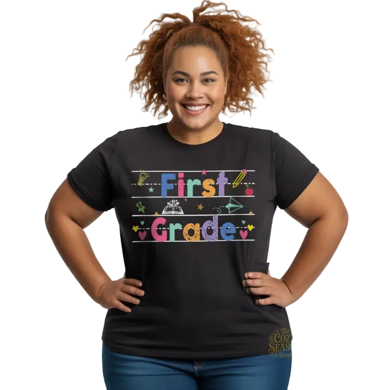 Custom grade school unisex t-shirt in black, featuring a vibrant "First Grade" chalkboard-style design with school doodles.