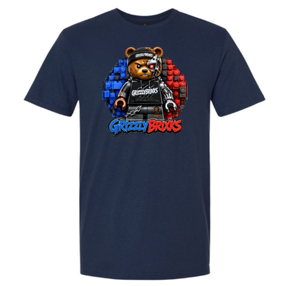 A navy blue short-sleeve t-shirt featuring a central graphic of a bear character built from toy blocks, with the text 'Grizzly Brixks' in blue and red below it.