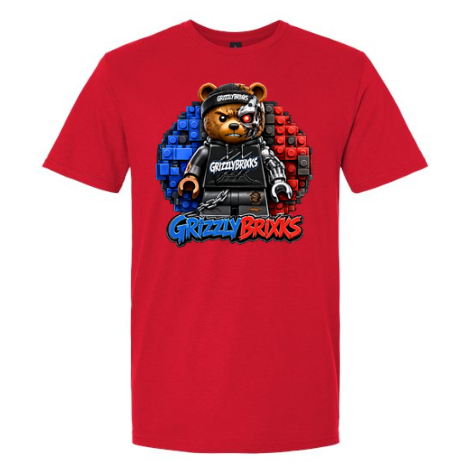 A red short-sleeve crewneck t-shirt featuring a 'Grizzly Brixks' graphic on the chest. The graphic depicts a bear character wearing a black outfit and cap, set against a circular background of blue and red building blocks, with 'Grizzly Brixks' written in stylized blue and red text below.