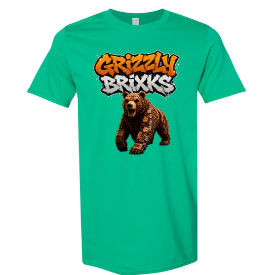 A green short-sleeve crewneck t-shirt featuring a graphic print of a brown bear and the text 'Grizzly Brixxs' in orange and white graffiti-style lettering, displayed on a solid white background.