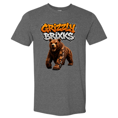 A heather gray short-sleeve crewneck t-shirt featuring a graphic print of a pixelated brown bear under the text 'Grizzly Brixxs' in orange and white graffiti-style lettering.