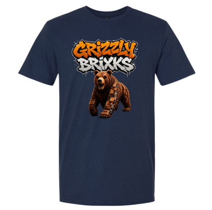 A navy blue short-sleeve t-shirt with a graphic on the chest featuring the text 'Grizzly Brixks' in orange and white graffiti-style lettering above a brown grizzly bear illustration.